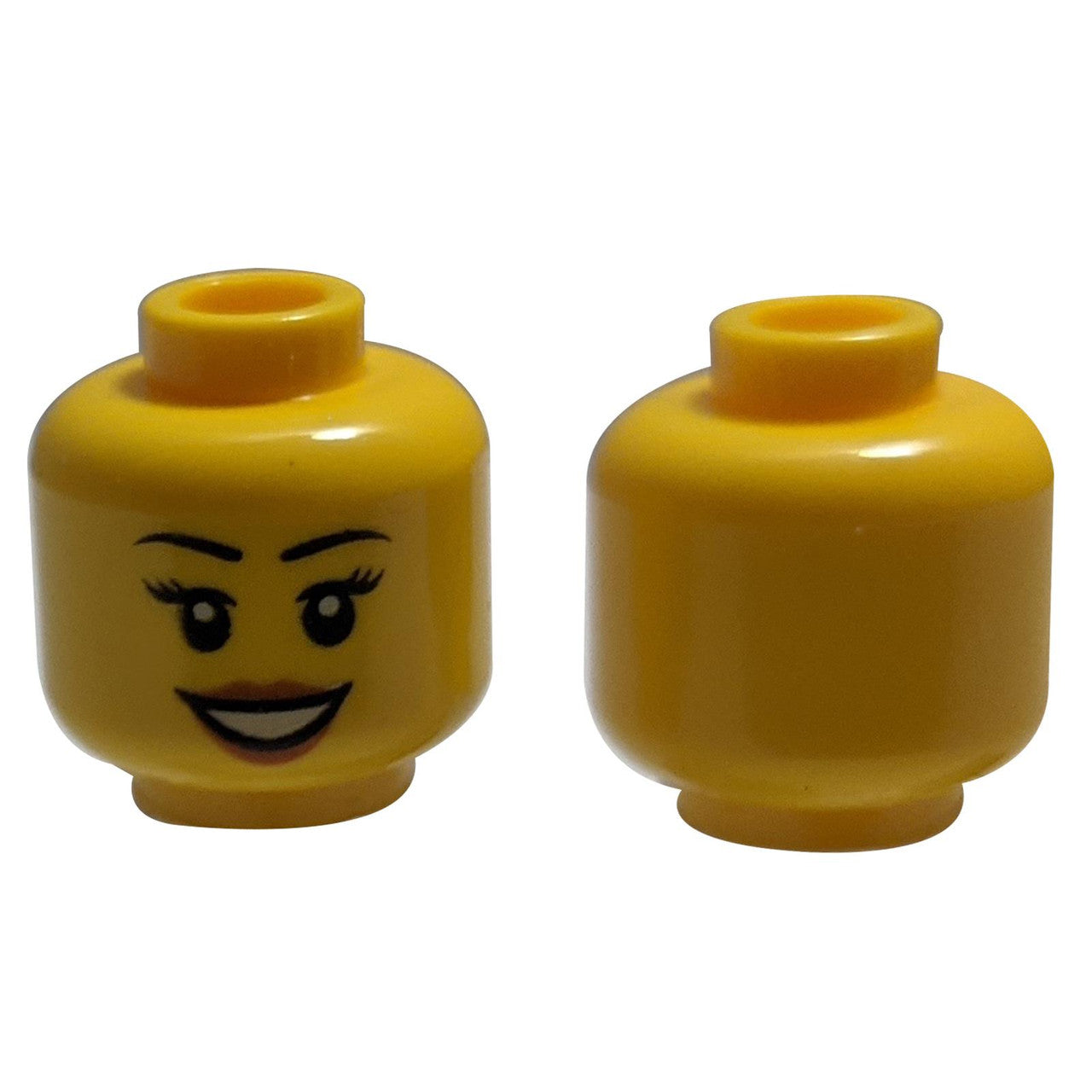 LEGO® female minifigure head with black eyebrows, peach lips, and an open smile.