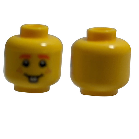 LEGO® minifigure head with orange eyebrows, freckles, and a smile with one tooth.