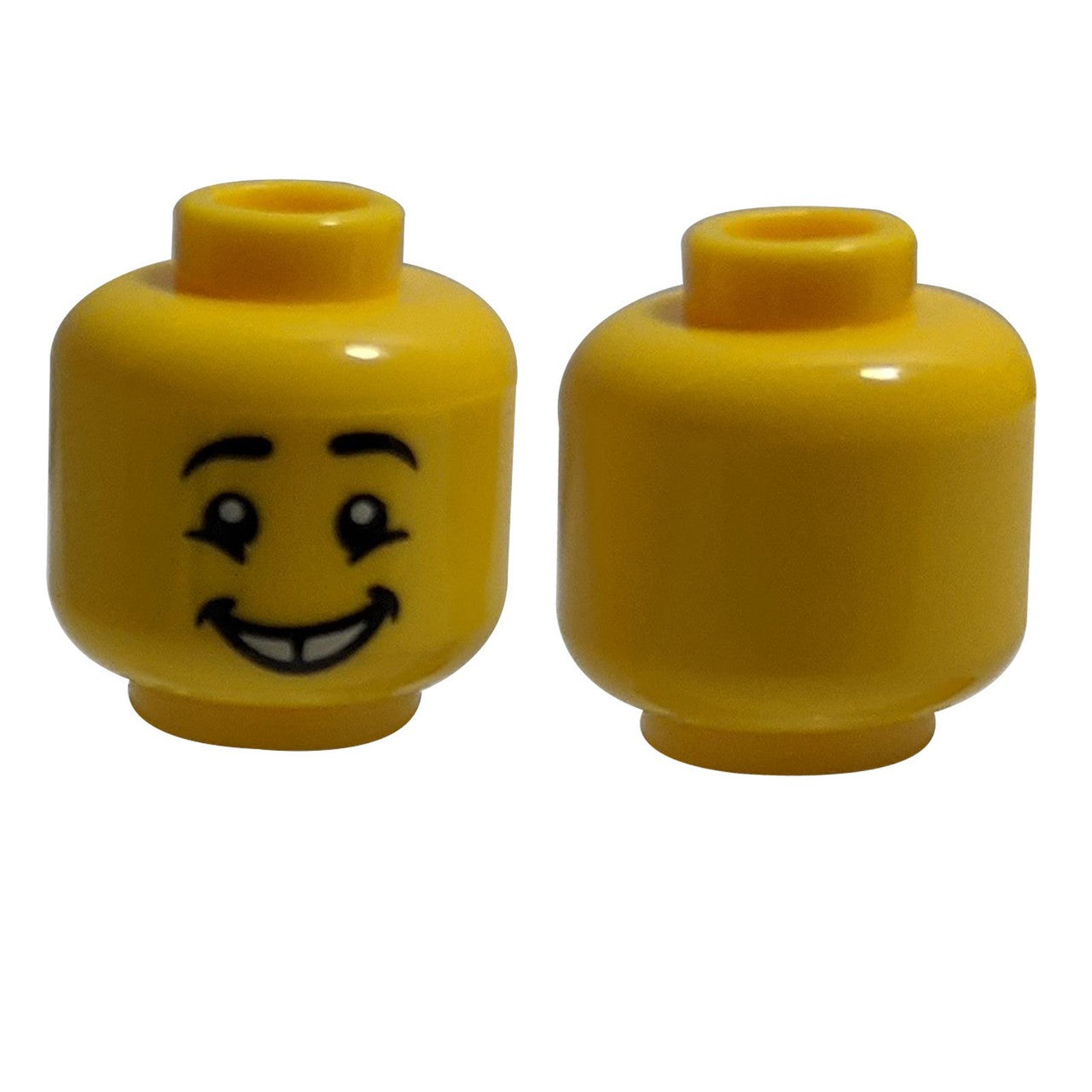 LEGO® minifigure head with black eyebrows, cheekbone lines, and a gap-tooth smile.